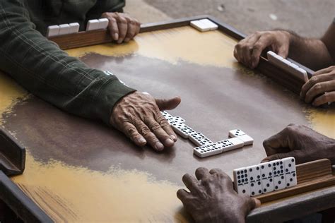 Play Jamaican Dominoes .